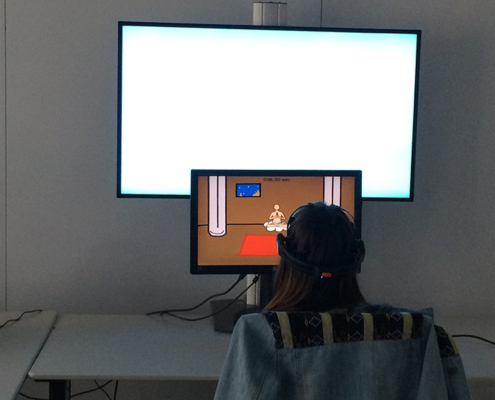 User study - User playing the "floating monk" game in the calmness stimulating environment
