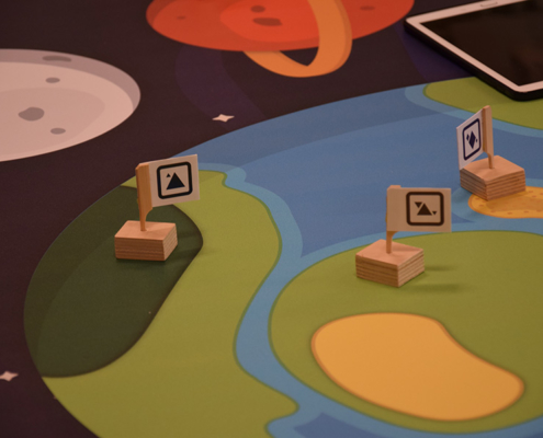 The robot can recognise the flags to locate its position